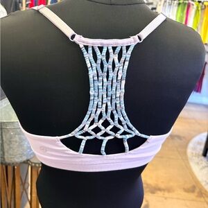 Women's Lululemon size 8 Lavender Sports Bra with Intricate Back.
